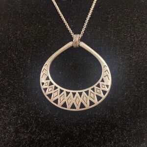 The Sak silver pendant necklace.